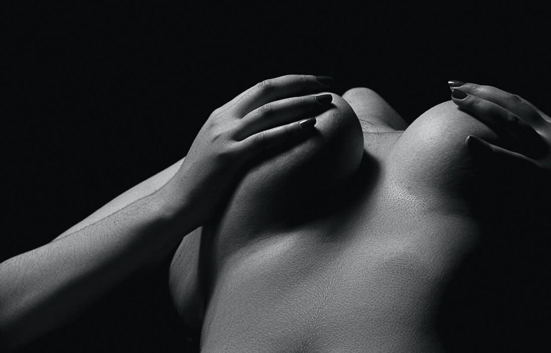 woman grabbing breasts